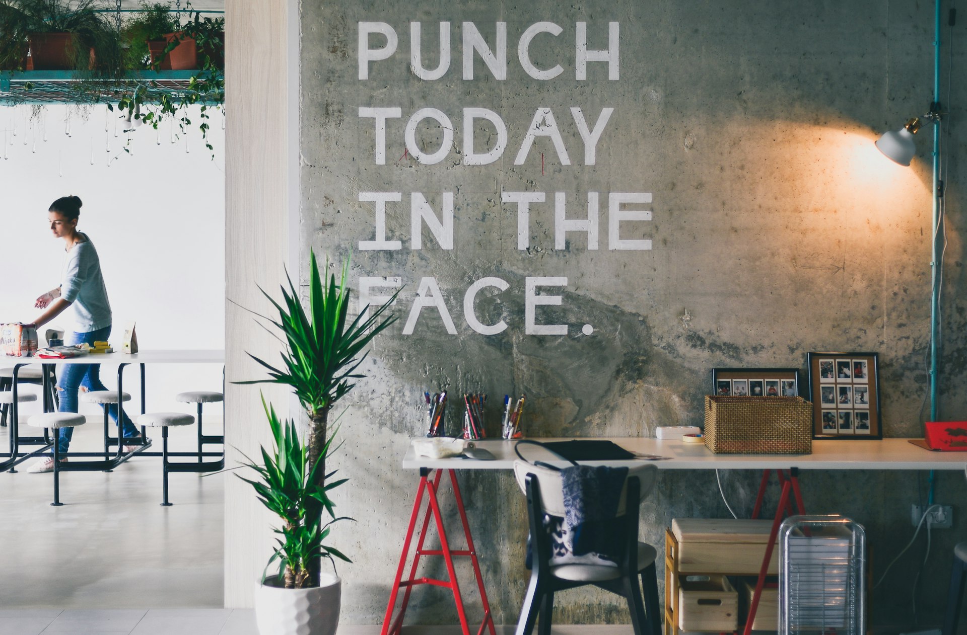 Motivational wall graphic with a bold statement in an office setting.